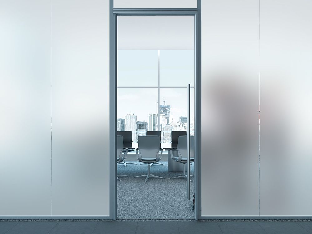 Manufacturer example of frosted glass panels around a conference-room entrance