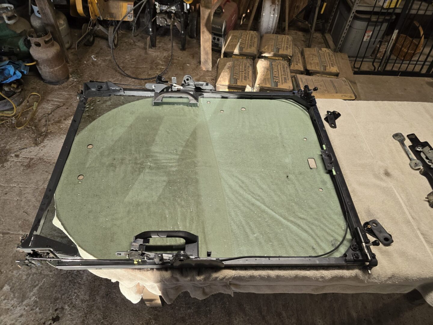 A table with a green cloth on top of it